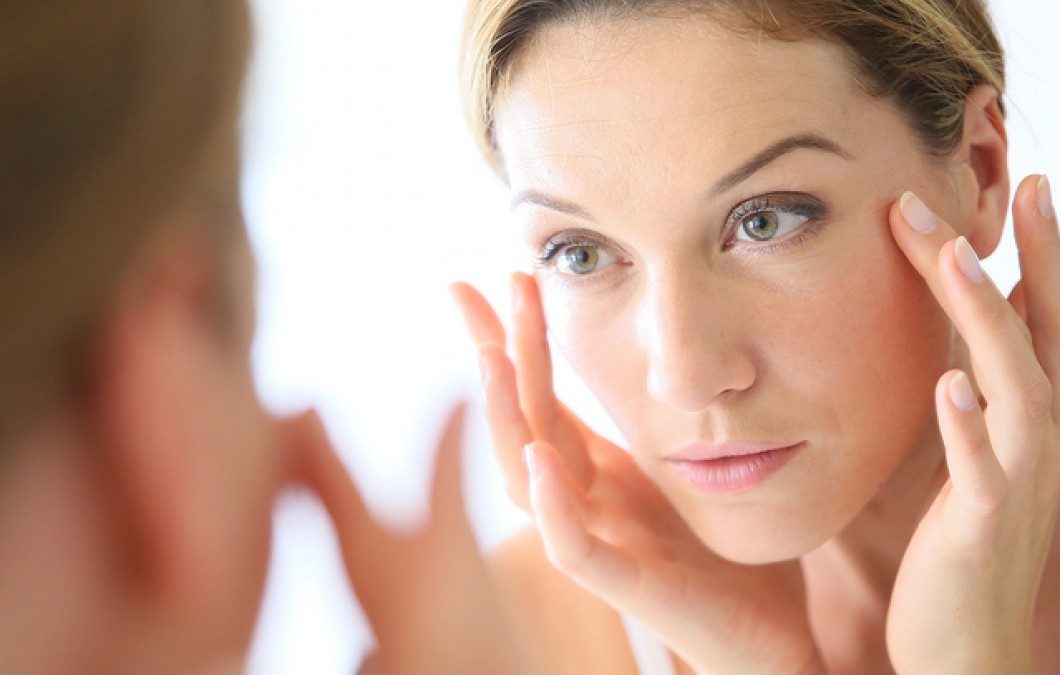 lady looking at herself in the mirror