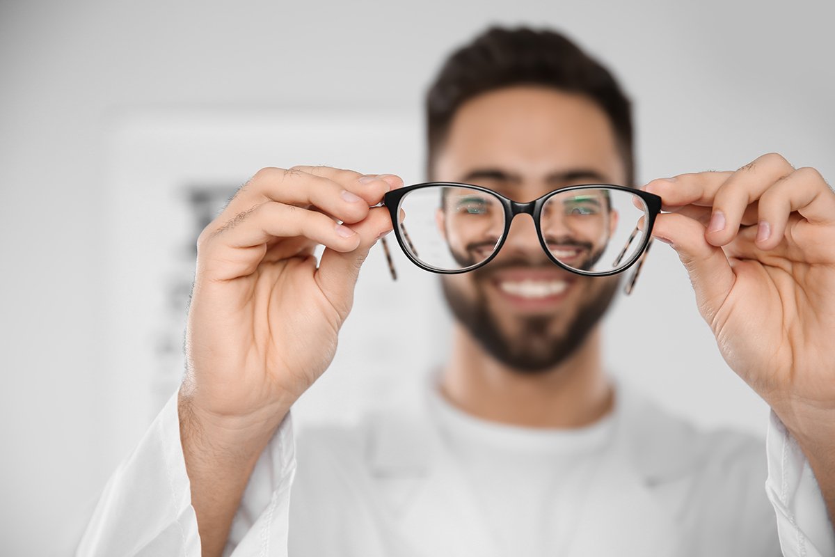 guy looking through his glasses