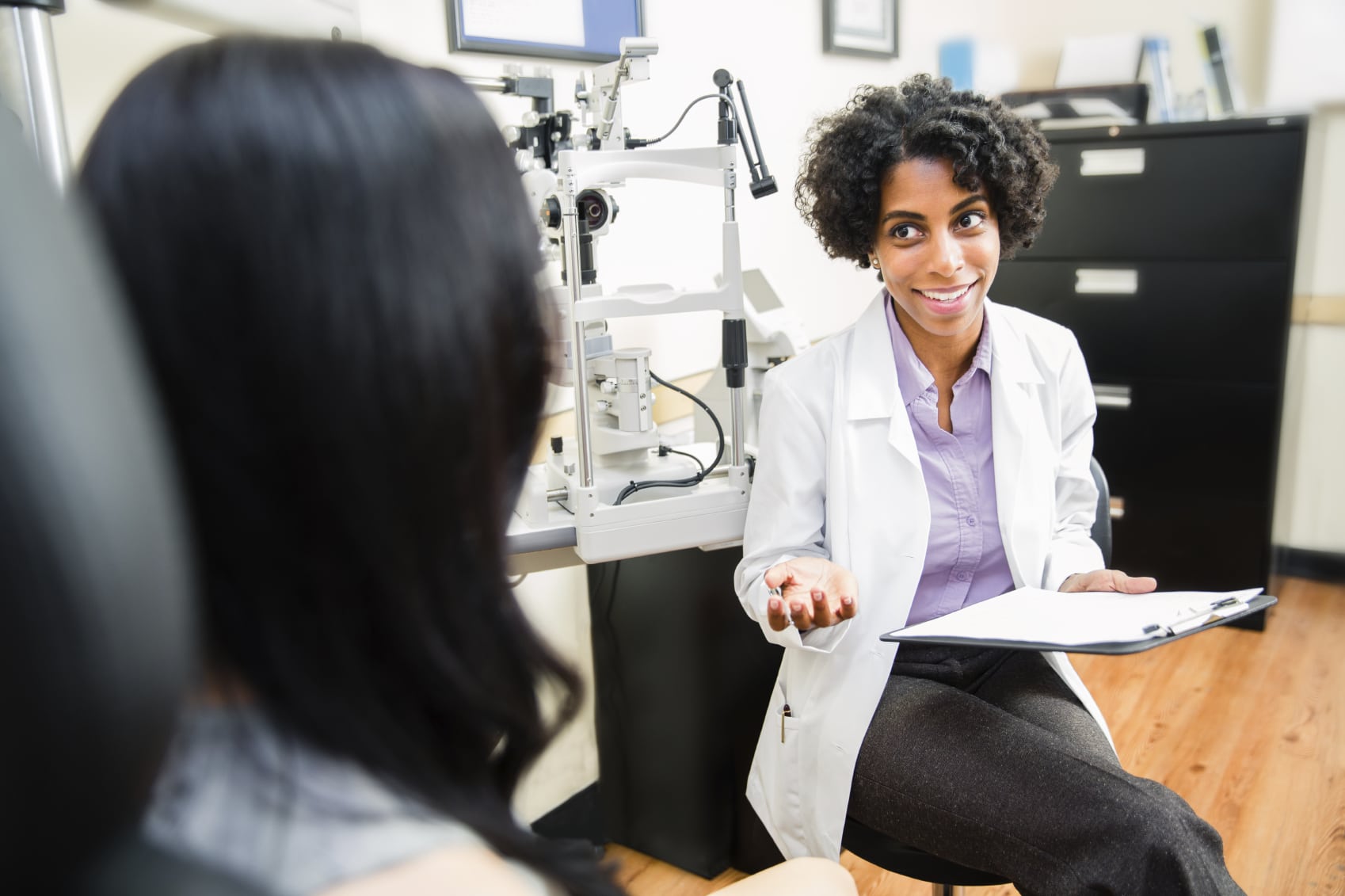 eye doctor consulting with patients